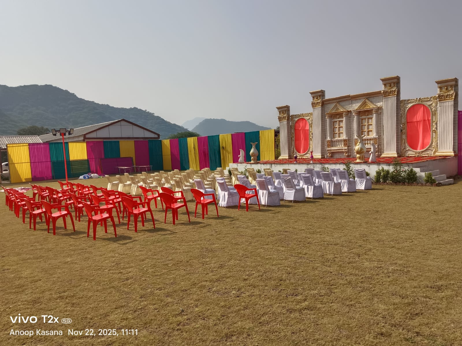 Outdoor stage and guest seating arranged for an event