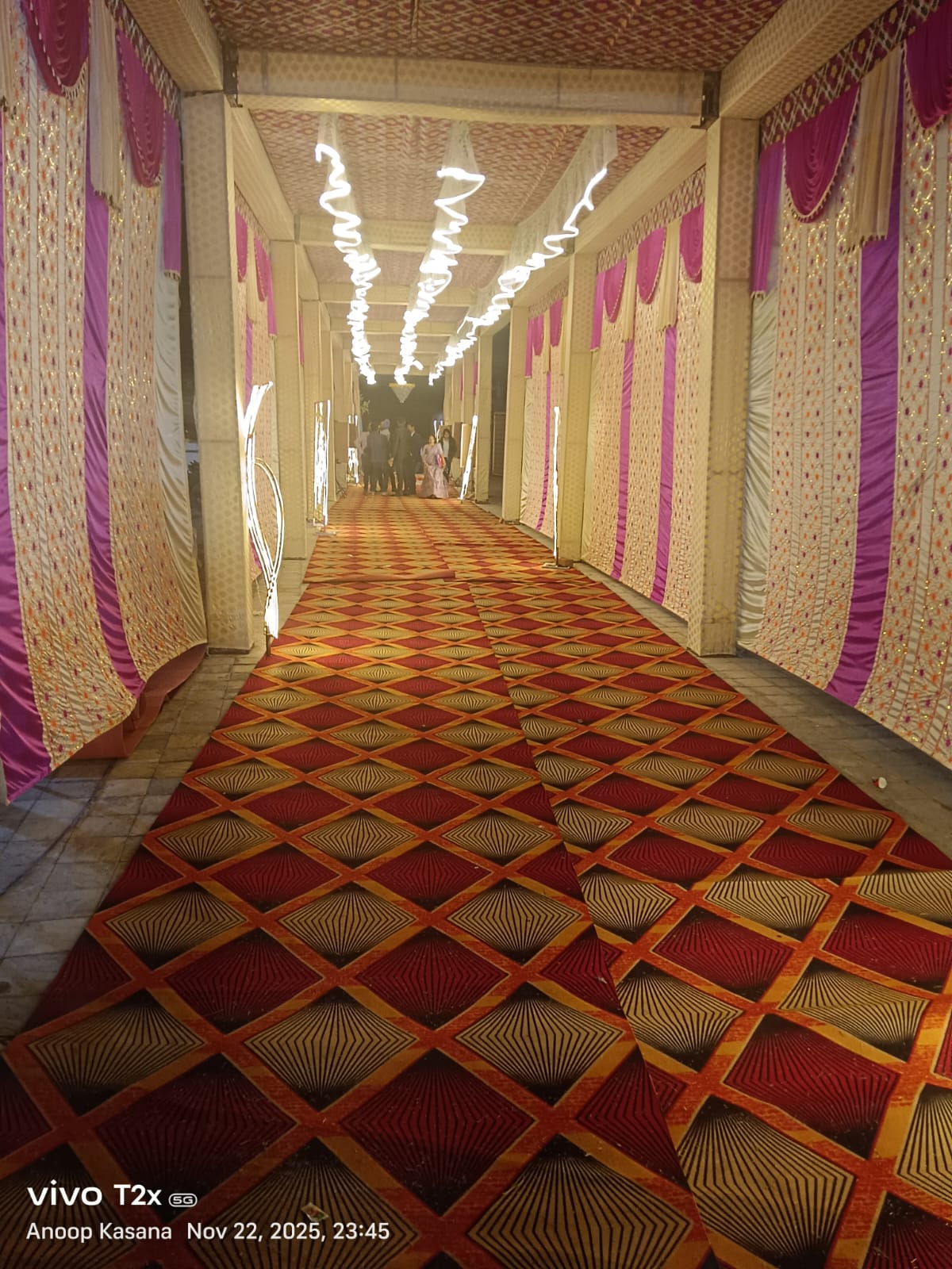 Night tent corridor with carpet and decorative lighting